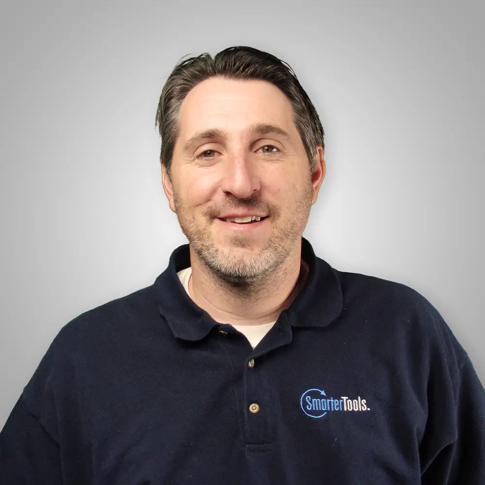 Headshot of Tim Uzzanti, SmarterTools team member wearing company polo